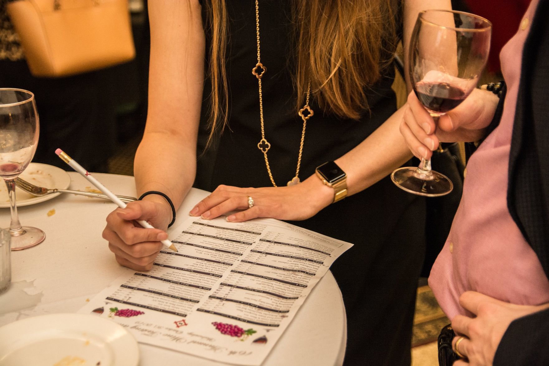 Guests mark wines they have tried on their wine lists